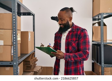 Young african american man ecommerce business worker organizing packages at office - Powered by Shutterstock