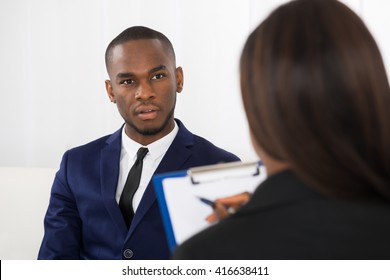 Young African American Man Explaining His Problems To The Psychologist