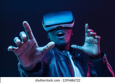 Young African American Man Having Virtual Reality Experience Using Vr Headset