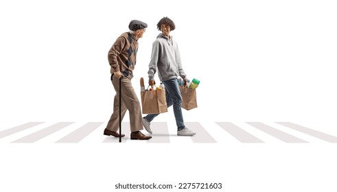 Young african american man helping a senior with grocery bags at a pedestrian crossing isolated on white background - Powered by Shutterstock