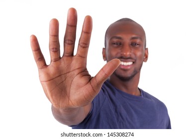 Young African American man his hands palm, isolated on white background