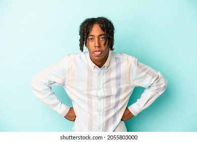 Young African American Man Isolated On Blue Background Funny And Friendly Sticking Out Tongue.