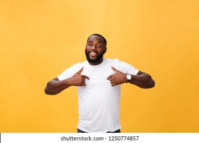 Young african american man over isolated background looking confident with smile on face, pointing oneself with fingers proud and happy
