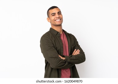 Young African American man over isolated white background with arms crossed and looking forward