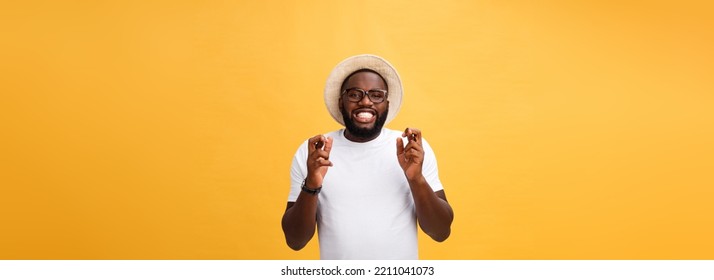 Young African American Man Over Isolated Background Smiling Crossing Fingers With Hope And Eyes Closed. Luck And Superstitious Concept