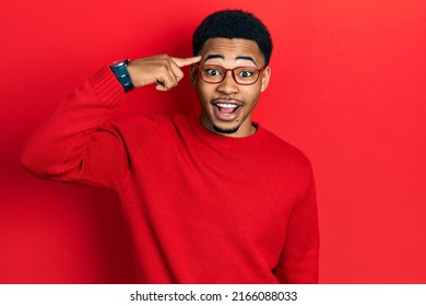 Young african american man pointing head with finger celebrating crazy and amazed for success with open eyes screaming excited.  - Powered by Shutterstock