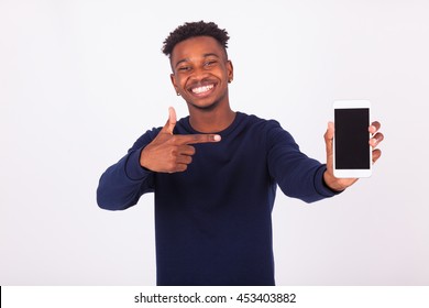 Young African American man pointing his  smartphone screen - Black teenager people