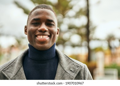 Young African American Man Smiling Happy Standing At The City