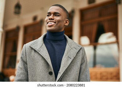 Young African American Man Smiling Happy Standing At The City