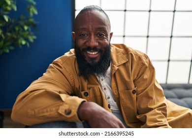 Young African American Man Smiling Confident Sitting On Sofa At Home