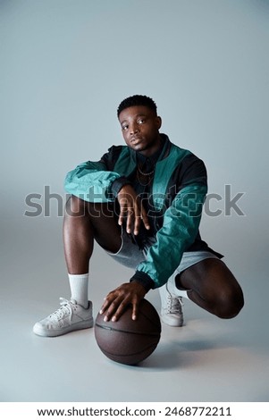 Image, Stock Photo Young talented basketball player is shooting hoops on his outdoor court and training for future games and tough situations. Preparing for the season. Shooting the basket