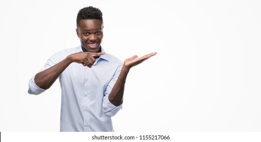 Young African American Man Wearing A Shirt Very Happy Pointing With Hand And Finger