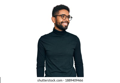 Young African American Man Wearing Casual Clothes Looking Away To Side With Smile On Face, Natural Expression. Laughing Confident. 