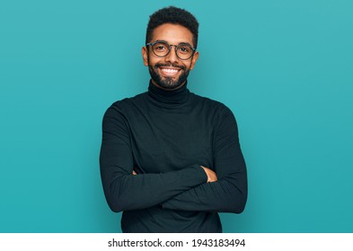 Young african american man wearing casual clothes happy face smiling with crossed arms looking at the camera. positive person. 