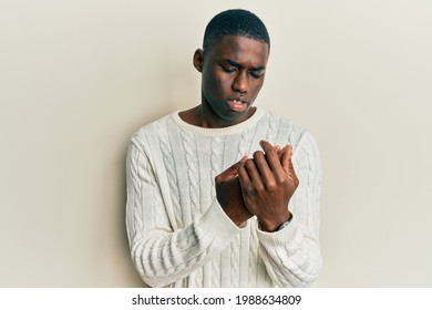 Young African American Man Wearing Casual Clothes Suffering Pain On Hands And Fingers, Arthritis Inflammation 