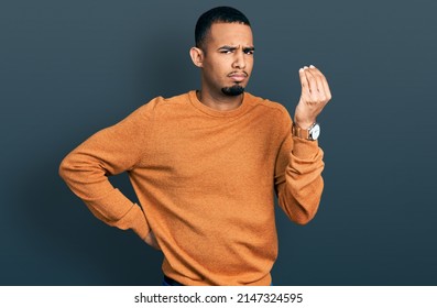 Young African American Man Wearing Casual Clothes Doing Italian Gesture With Hand And Fingers Confident Expression 