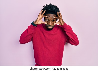 Young African American Man Wearing Casual Clothes Trying To Open Eyes With Fingers, Sleepy And Tired For Morning Fatigue 