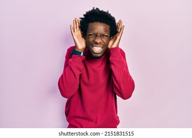 Young African American Man Wearing Casual Clothes Trying To Hear Both Hands On Ear Gesture, Curious For Gossip. Hearing Problem, Deaf 