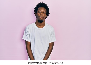 Young african american man wearing casual white t shirt depressed and worry for distress, crying angry and afraid. sad expression.  - Shutterstock ID 2166393705