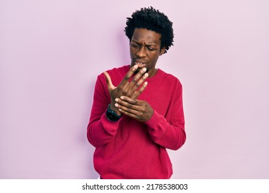 Young African American Man Wearing Casual Clothes Suffering Pain On Hands And Fingers, Arthritis Inflammation 