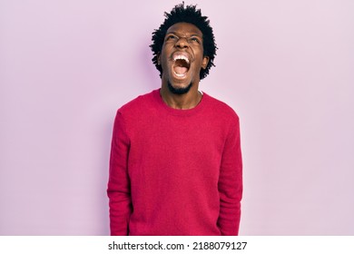 Young african american man wearing casual clothes angry and mad screaming frustrated and furious, shouting with anger. rage and aggressive concept.  - Shutterstock ID 2188079127