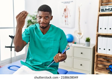 Young African American Man Working At Pain Recovery Clinic Doing Italian Gesture With Hand And Fingers Confident Expression 