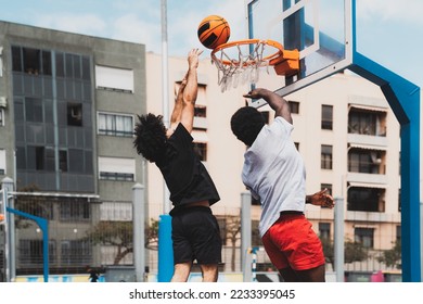 Young African American men playing basketball outdoor - Urban sport lifestyle concept - Shutterstock ID 2233395045