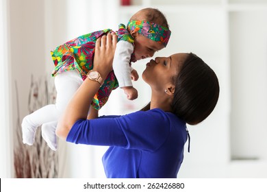 Young African American Mother Playing With Her Baby Girl