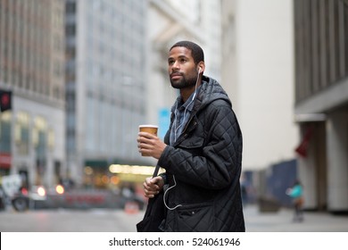 Young African American Professional Walking To Work In The City With Coffee Cup, Photographed In NYC In November