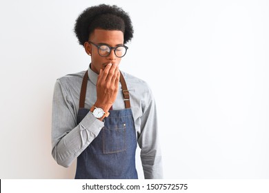 Young African American Shopkeeper Man Wearing Apron Glasses Over Isolated White Background Bored Yawning Tired Covering Mouth With Hand. Restless And Sleepiness.