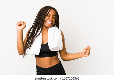 Young african american sport woman isolated dancing and having fun. - Powered by Shutterstock