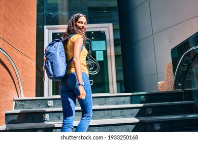 Young African American Student Girl Smiling Happy Going Up Stairs Of Music Academy.