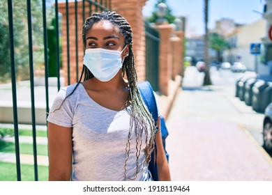 Young African American Student Woma Wearing Coronavirus Safety Mask At The University Campus