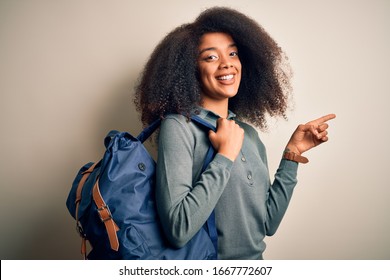 Young African American Student Woman With Afro Hair Wearing Backpack Over Background Very Happy Pointing With Hand And Finger To The Side