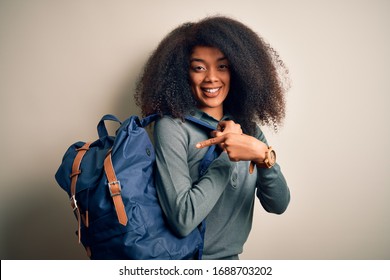 Young African American Student Woman With Afro Hair Wearing Backpack Over Background Very Happy Pointing With Hand And Finger