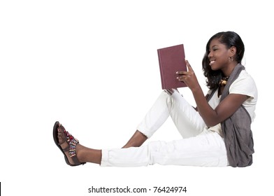 A young African American teenage woman reading a book
