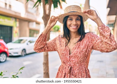 Young african american tourist woman on vacation smiling happy walking at the city.