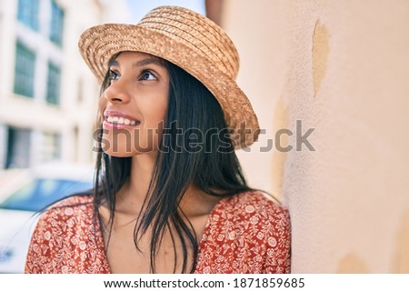 Young african american tourist woman on vacation smiling happy at the city.