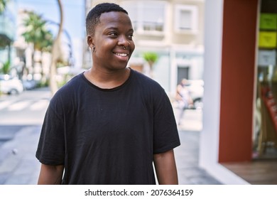 Young african american transgender smiling confident at street