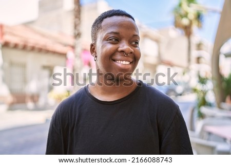 Young african american transgender smiling confident at street Foto stock © 