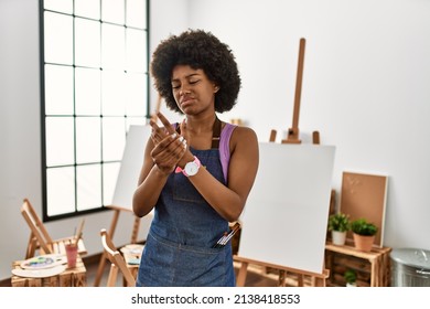 Young African American Woman With Afro Hair At Art Studio Suffering Pain On Hands And Fingers, Arthritis Inflammation 