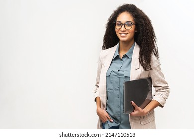 Young African American Woman With Afro Hairstyle Wearing Smart Casual Wear And Stylish Eyeglasses Standing Isolated On White , Carrying Laptop Computer, Smiling, Female Office Employee, Student