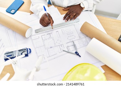 Young African American Woman Architect Drawing On House Plans At Architecture Studio