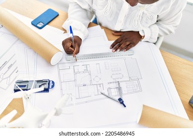 Young African American Woman Architect Drawing On House Plans At Architecture Studio