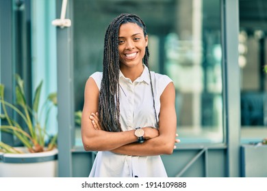 Young African American Woman With Arms Crossed Smiling Happy At The City.