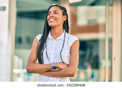 Young African American Woman With Arms Crossed Smiling Happy At The City.