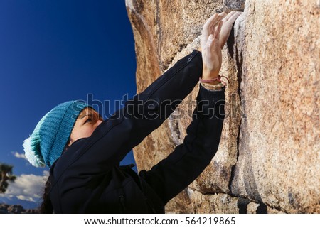 Similar – Little boy looking through the wall of a castle