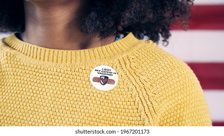 Young African American Woman With Covid Vaccination Sticker After Getting The Coronavirus Vaccine