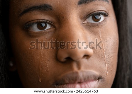 Young African American woman crying