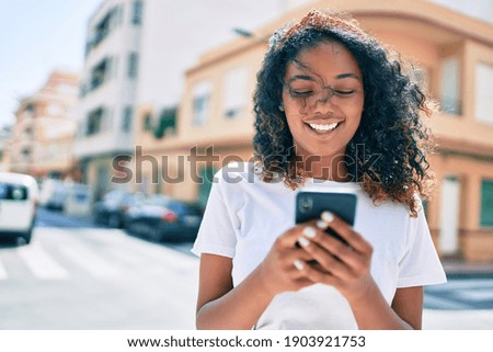 Similar – Image, Stock Photo Young african american woman web-surfing internet